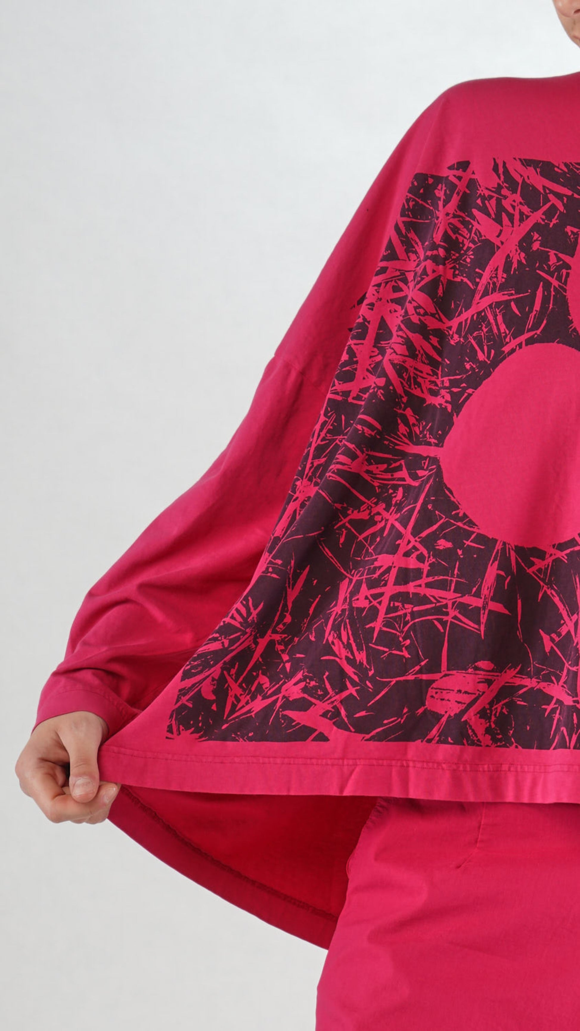 Women's round neck, long sleeve boxy relaxed tee from Black Label. In colour lotus with black floral graphic. Detail view.
