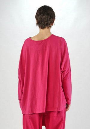 Women's round neck, long sleeve boxy relaxed tee from Black Label. In colour lotus with black floral graphic. Back view.