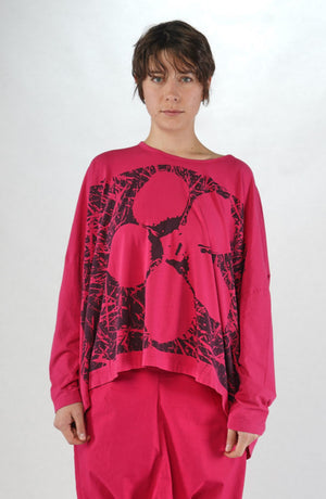 Women's round neck, long sleeve boxy relaxed tee from Black Label. In colour lotus with black floral graphic. Front view. 