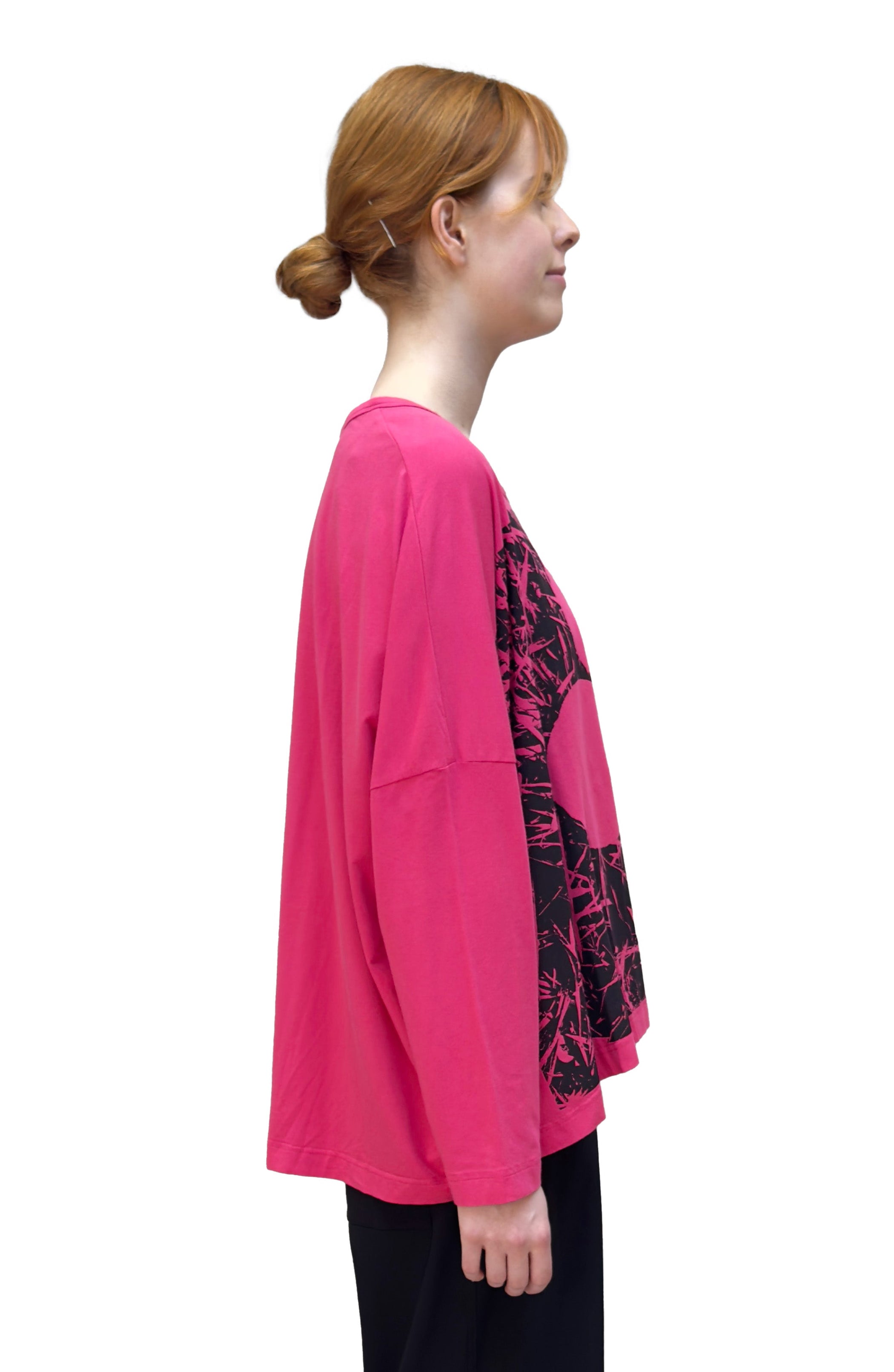 Women's round neck, long sleeve boxy relaxed tee from Black Label. In colour lotus with black floral graphic. Side view.