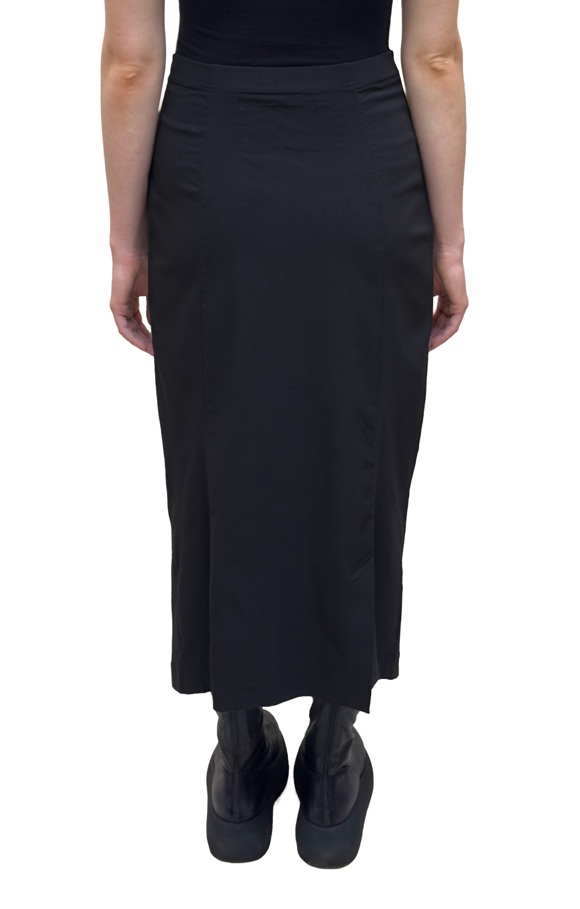 Women's ankle length fitted pencil skirt with a flat elastic waistband. Made in a technical fabric from Black Label. In colour black. back view.