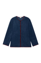 Navy blue cardigan with red trim on a white background