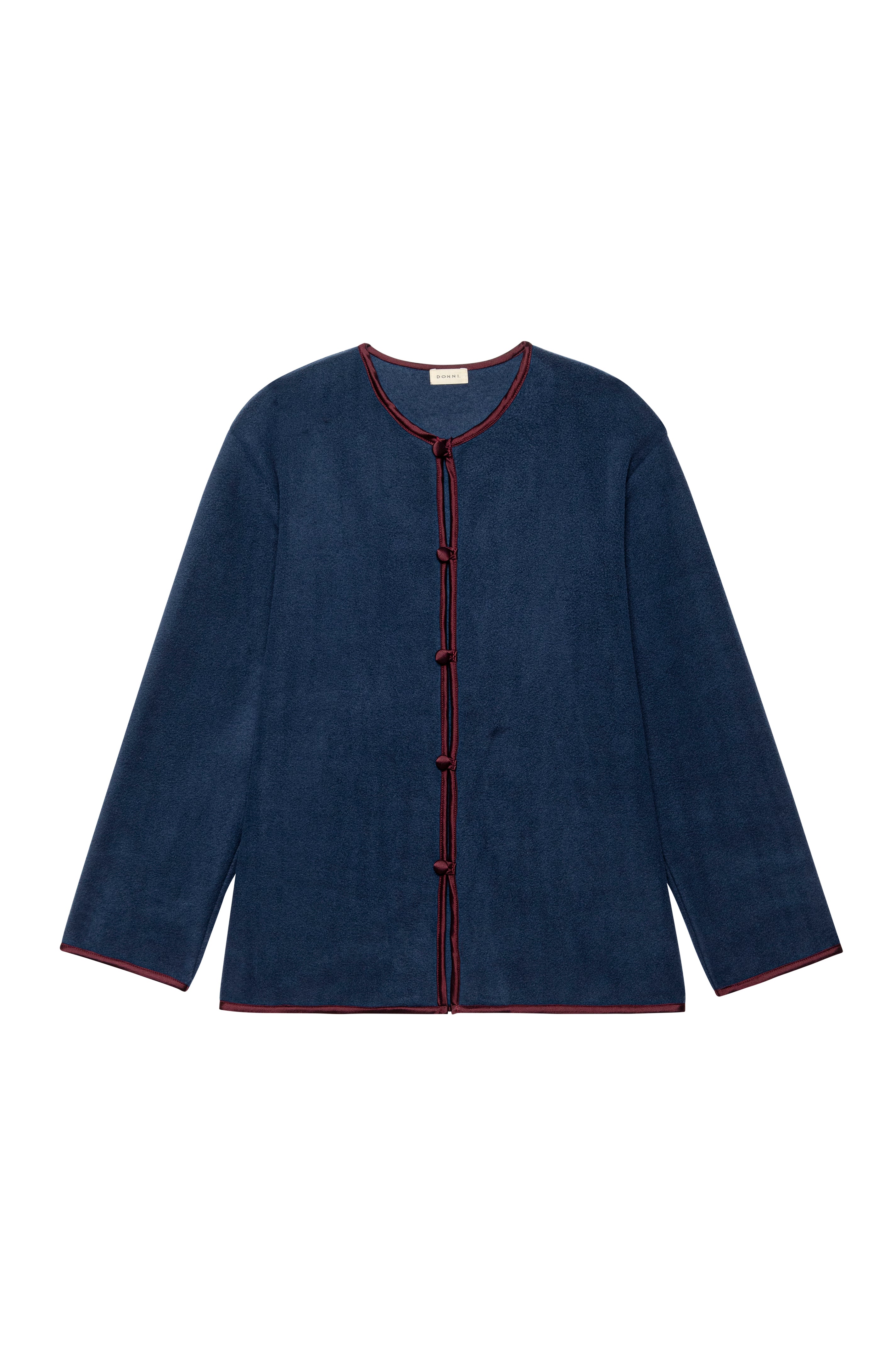 Navy blue cardigan with red trim on a white background