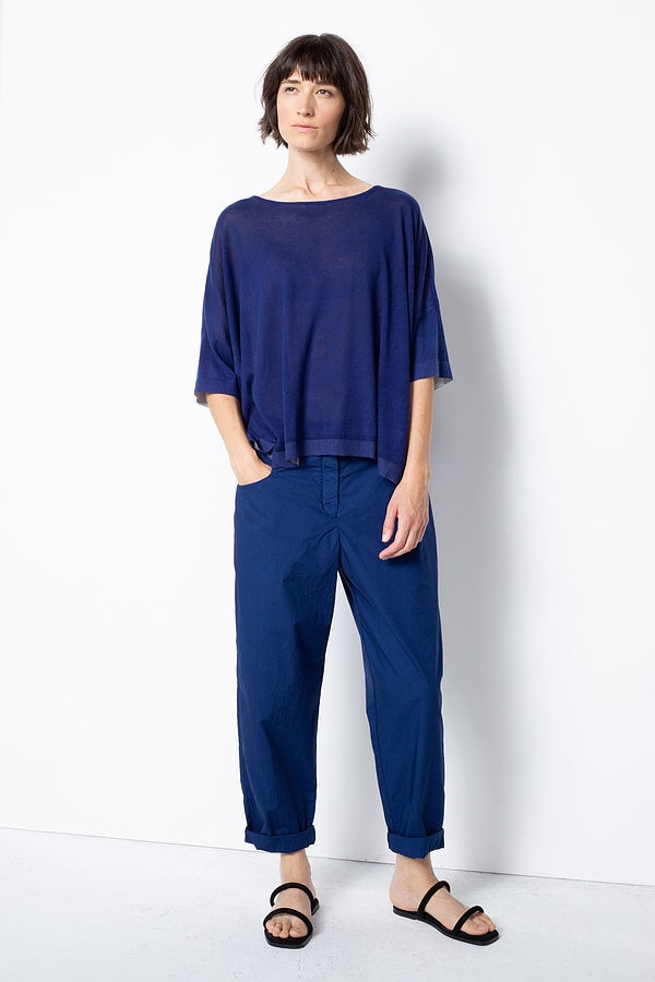 Women's long, cuffed tapered pant, with front button closure, squared pockets, and back elasticized waistband by Oska. Full front view.